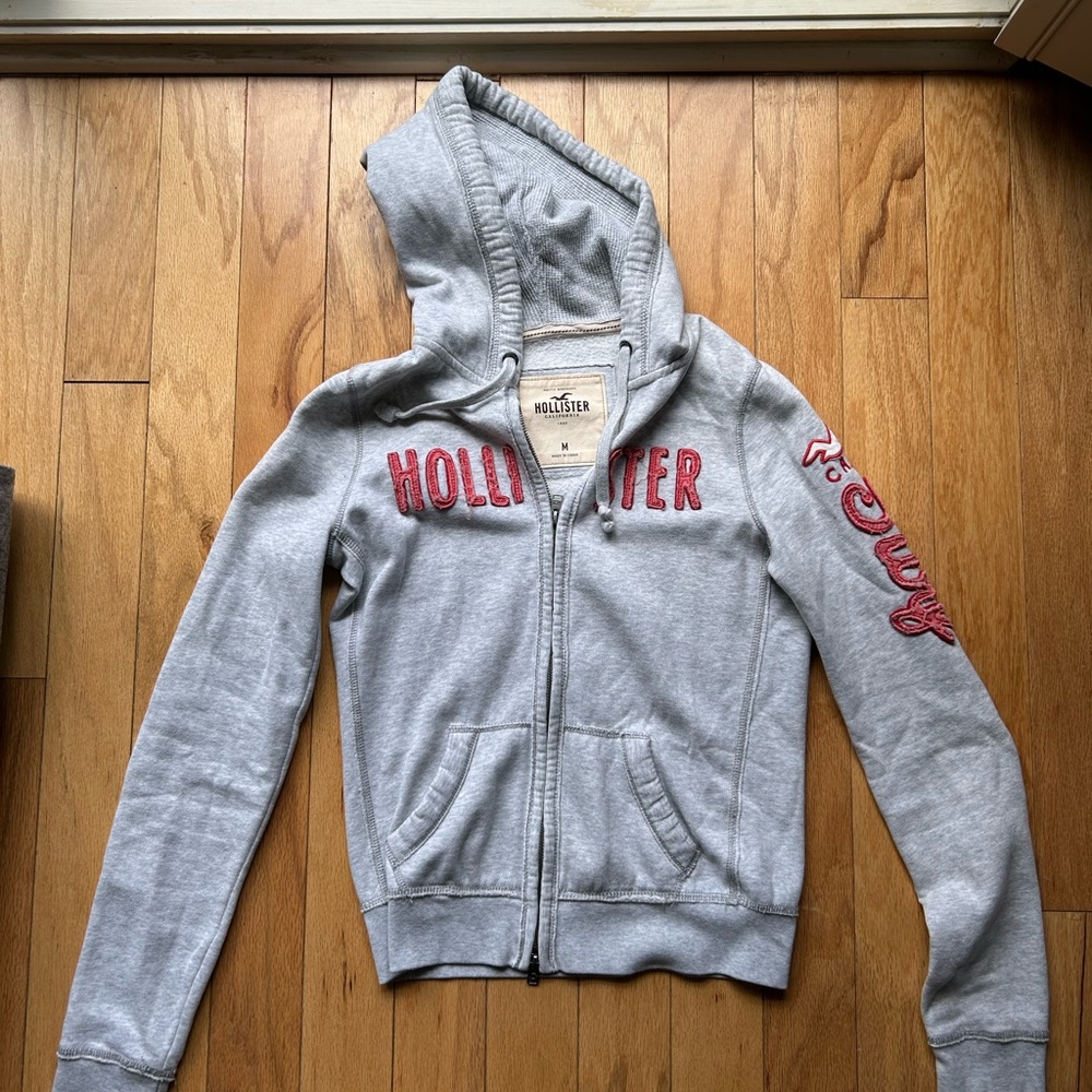 Hollister Light Gray Hoodie with Red Lettering Women’s Medium